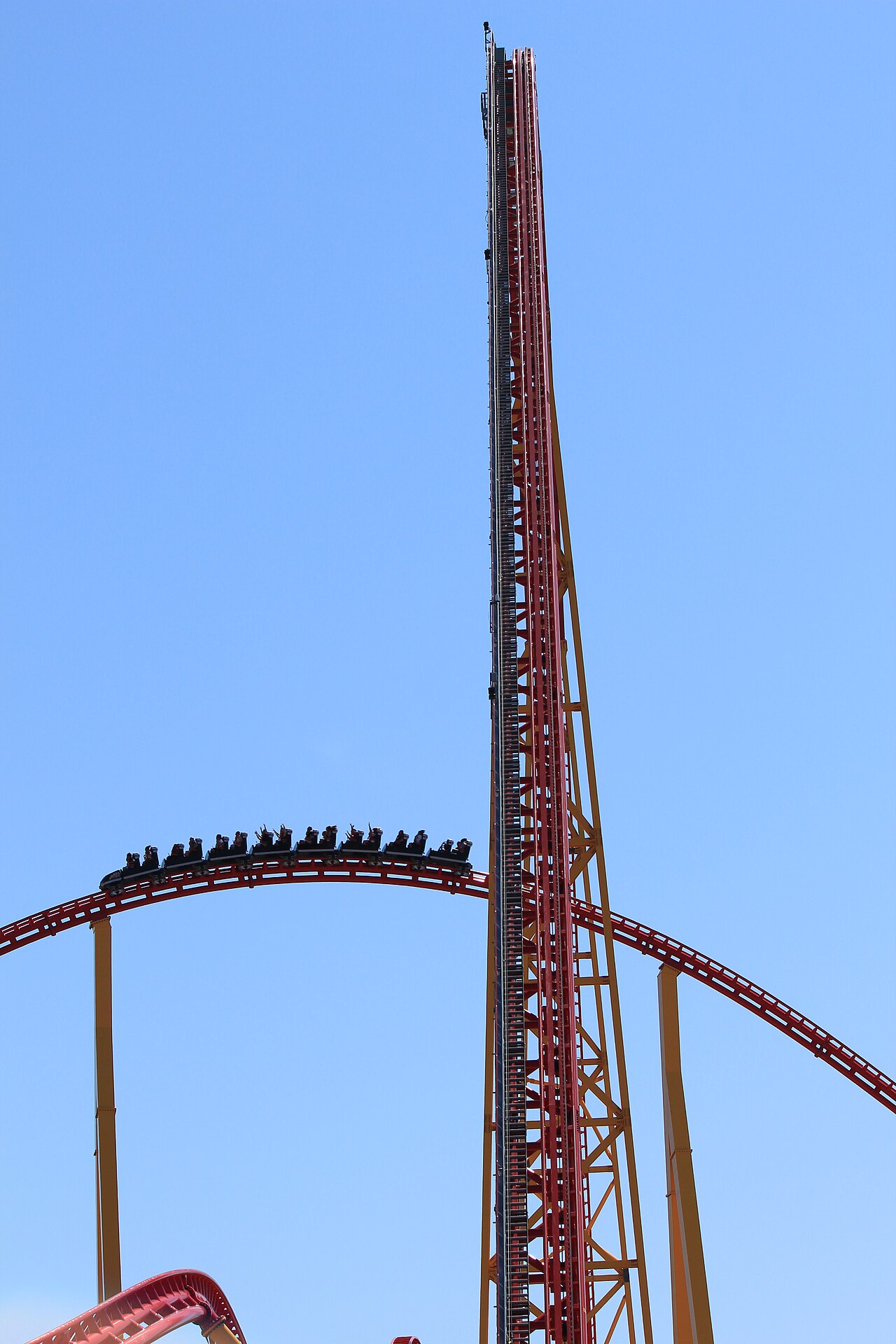 Pantherian train passing under the lift hill at Kings Dominion amusement park