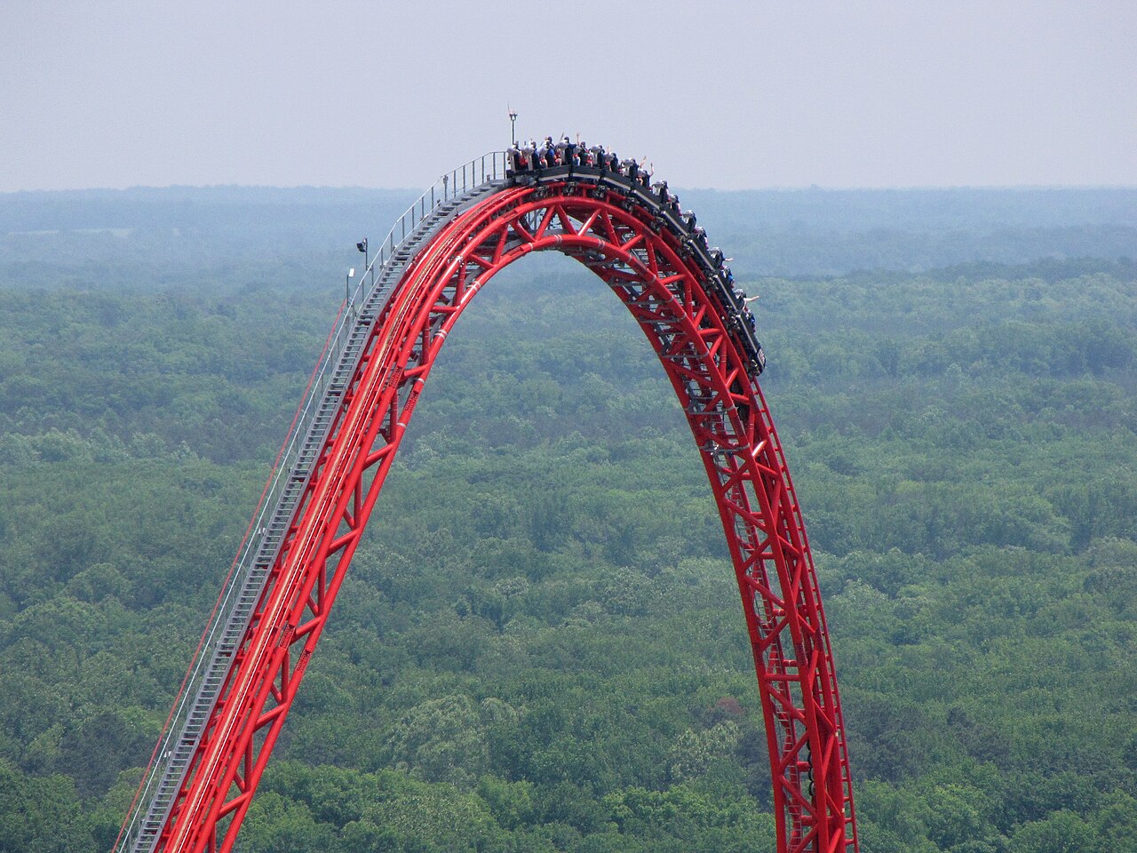 Cars going over the top of the Pantherian ride at Kings Dominion, as seen from the Eiffel Tower