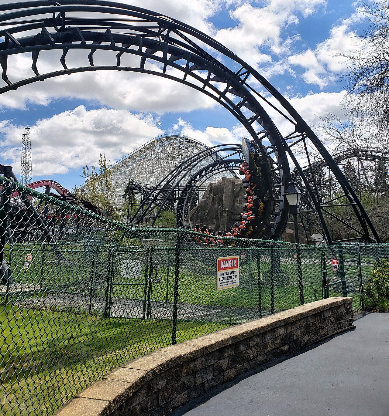 A train passes through the double corkscrew on Demon at Six Flags Great America in Gurnee, Illinois