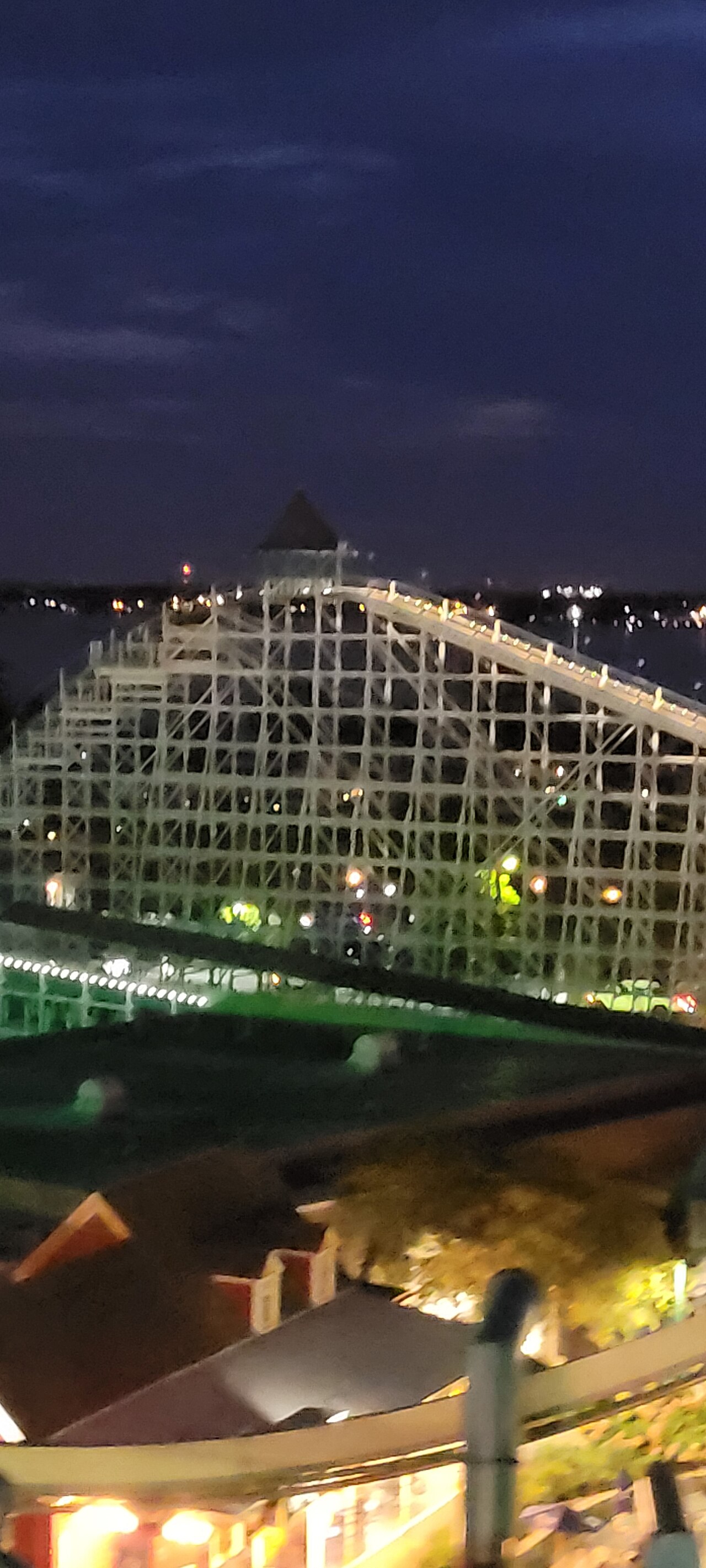 The highest point on Cedar Point's Blue Streak rollercoaster seen at night from the Sky Ride cable car