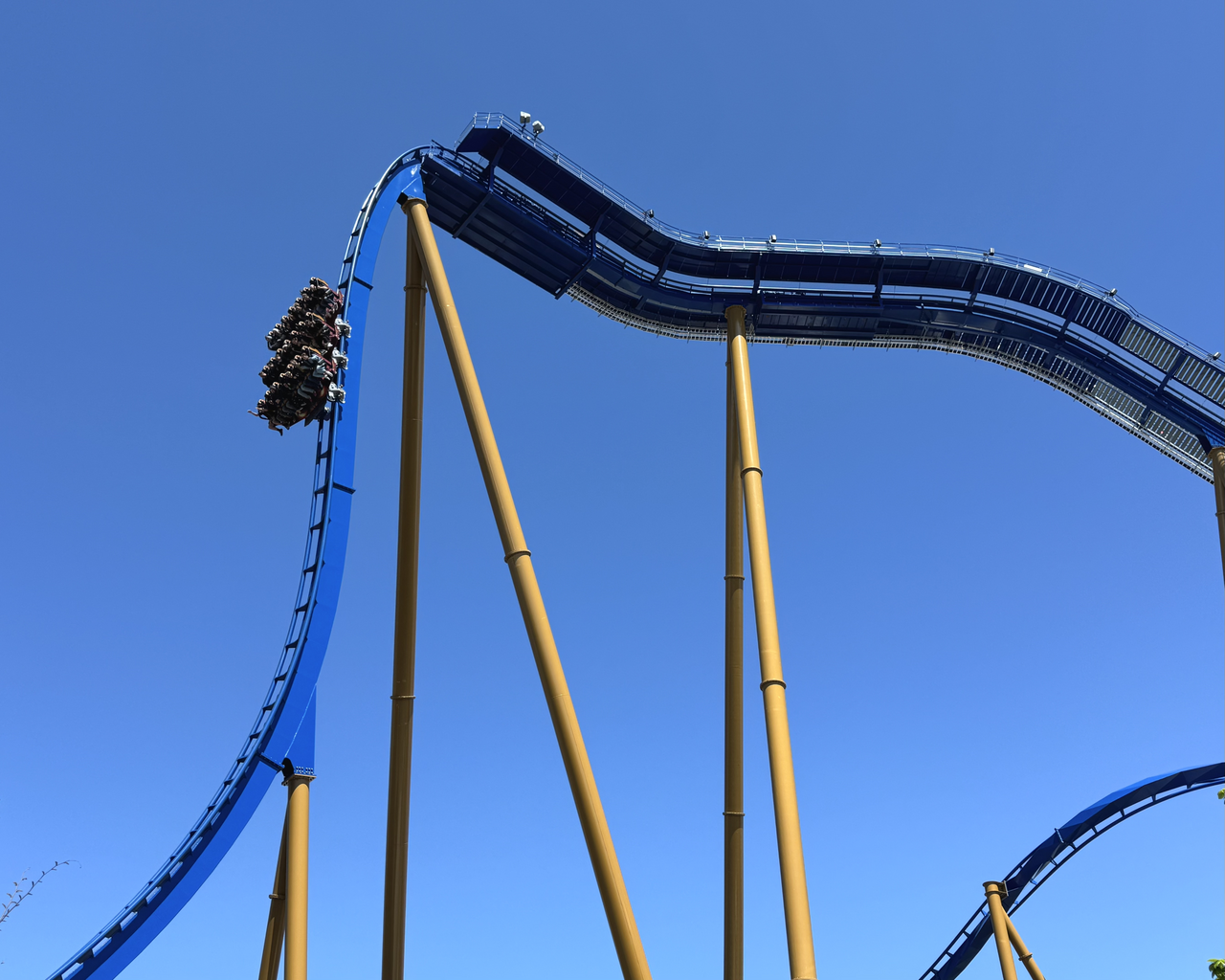 A train on Wrath of Rakshasa at Six Flags Great America in Gurnee, IL, descending a drop