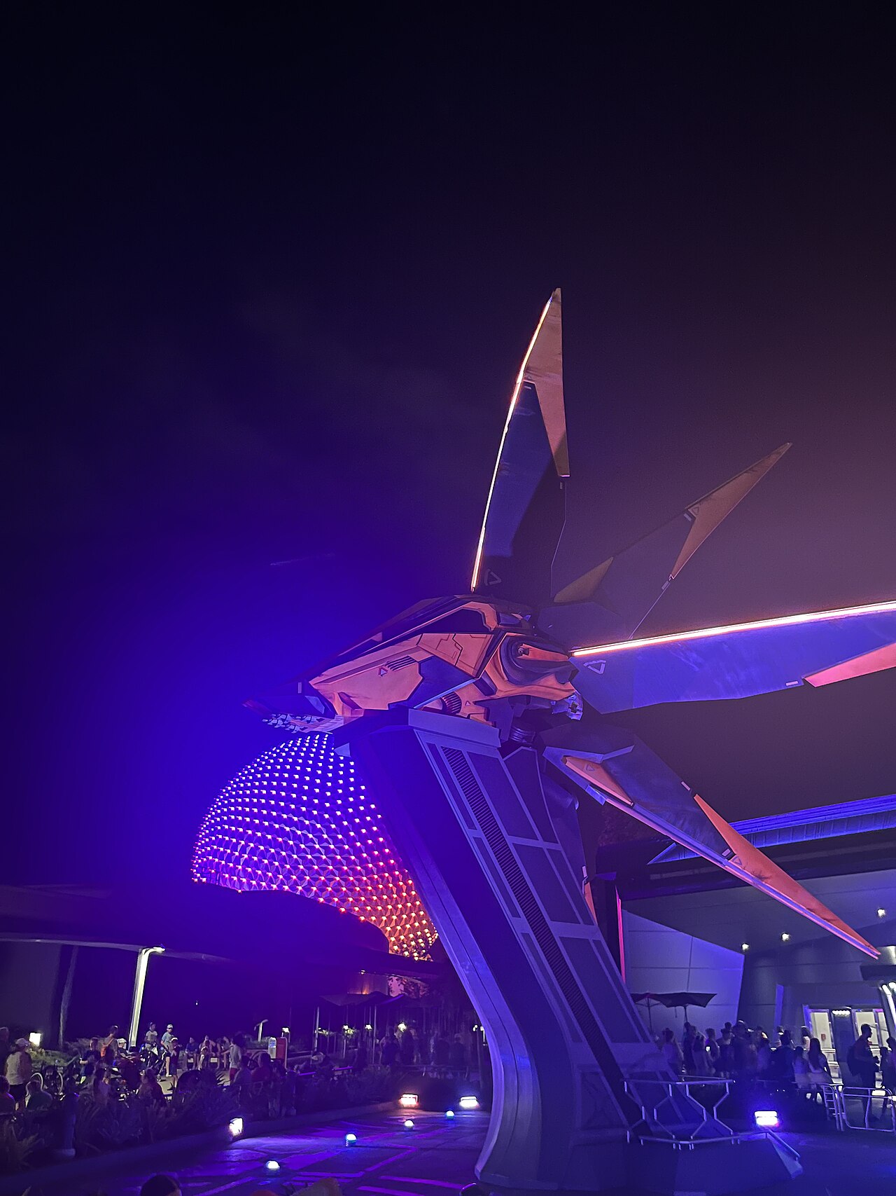 Night-time photo of Guardians of the Galaxy Cosmic Rewind with Spaceship Earth in the background