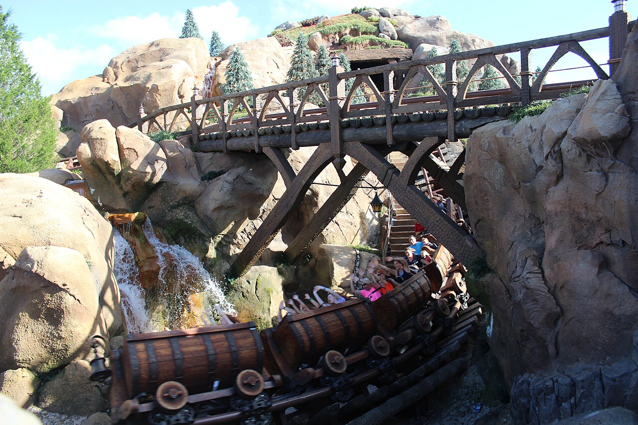Barrel cars running under the bridge by the waterfall